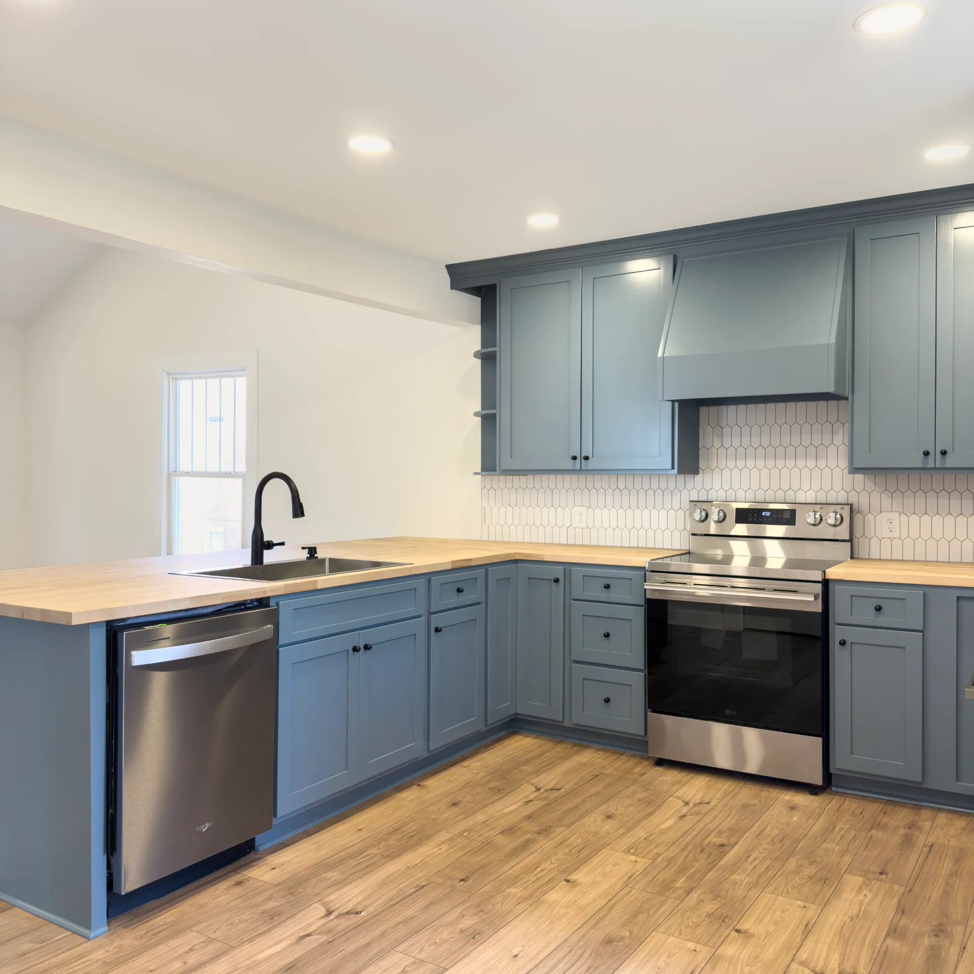 Birch kitchen w/ Chic Blue Cabinets